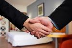 Handshake Between Two Business Partners Stock Photo