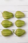 Chayote Fruit On White Wood Background Stock Photo