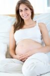 Pregnant Woman Relaxing At Home Stock Photo