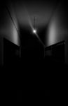 Dark Hallway With A Single Light Stock Photo