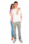 Smiling Girl Embracing Teenage Boy Stock Photo