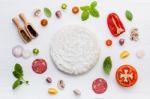 The Ingredients For Homemade Pizza On White Wooden Background Stock Photo