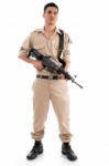 Standing Young Soldier With Gun Stock Photo