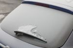 Parked Car Covered With The First Snow In Winter Stock Photo