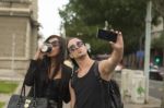 Young Couple Taking Selfies Stock Photo