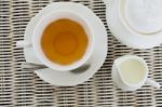 Cup Of Tea With Little Milk Jar And Teapot Stock Photo