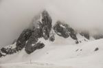 Jade Dragon Snow Mountain With Cloudy In Lijiang ,china Stock Photo