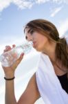 Woman Drinking Water After Sport Activities Stock Photo