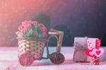 Roses And Gifts On Wooden Stock Photo