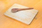 Chopping Block And Wood Spoon On The Table Stock Photo