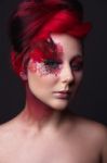 Young Girl With Red Hair And Creative Ingenious Makeup Stock Photo