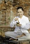 Woman Playing A Tibetan Bowl Stock Photo