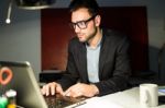 Handsome Young Businessman Working With Laptop In The Office Stock Photo