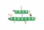 Miniature Worker Team Building Word Love Forever On White Backgr Stock Photo