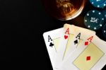 Poker, Whiskey And Money Stock Photo