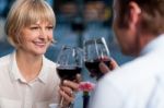 Couple Toasting In A Restaurant Stock Photo