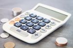 Calculator With Money On Grey Background Stock Photo