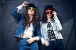 Young Beautiful Girls With Denim Suit In A Urban Background Stock Photo