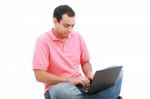 Young Man Working In Laptop Stock Photo