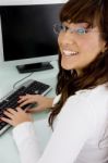 Businesswoman Working On Desktop Stock Photo