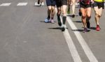 Detail Of A Group Of Runners During A City Marathon Stock Photo