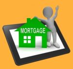 Mortgage House Tablet Shows Paying Off Property Debt Stock Photo