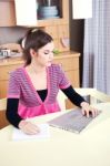 Girl Working On Laptop At Home Stock Photo