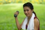 Beautiful Woman Holding Weights Stock Photo