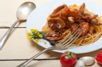 Italian Seafood Spaghetti Pasta On Red Tomato Sauce Stock Photo