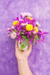 Hand Holding Bouquet Of Chrysanthemum And Orchid Flowers Isolate Stock Photo