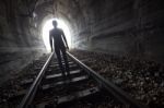 Man In A Tunnel Looking Towards The Light Stock Photo