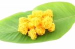 Near Sweetmeat Made Of Egg Yolk And Sugar On Banana Leaf Stock Photo