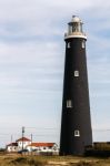 Lighthouse On The Beach At Dungeness Stock Photo