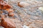 Sea Wave Covers Large Stones Stock Photo