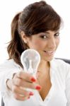 Smiling Businesswoman Holding Bulb Stock Photo