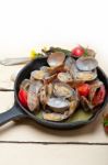 Fresh Clams On An Iron Skillet Stock Photo