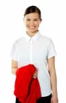 School Girl Holding Her Red Sweater Stock Photo