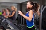 Beautiful Brunette On A Treadmill Stock Photo