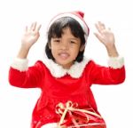 Little Girl Dressed As Santa Claus Stock Photo