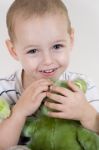 Child Holding Teddy Bear Stock Photo