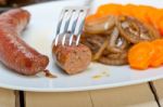 Beef Sausages Cooked On Iron Skillet Stock Photo