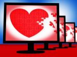 Puzzle Heart On Monitors Shows Love Stock Photo