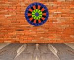 Dartboard On Brickwall Stock Photo