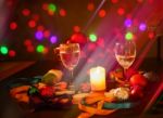 Two Glasses Of Champagne With A Christmas Decor In The Background Stock Photo