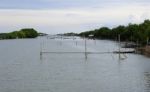 The Canal With Fish Poles Stock Photo