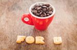 For U Alphabet Biscuit With Red Coffee Cup Stock Photo