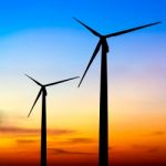 Wind Turbine Silhouette On Colorful Sunset Stock Photo