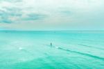 The View Of The Sand Beach And Sea Wave With Rock And Cloudy On The Afternoon Stock Photo