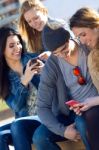 Friends Having Fun With Smartphones Stock Photo