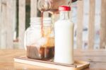 Pouring Espresso To Iced Glass Of Coffee Stock Photo